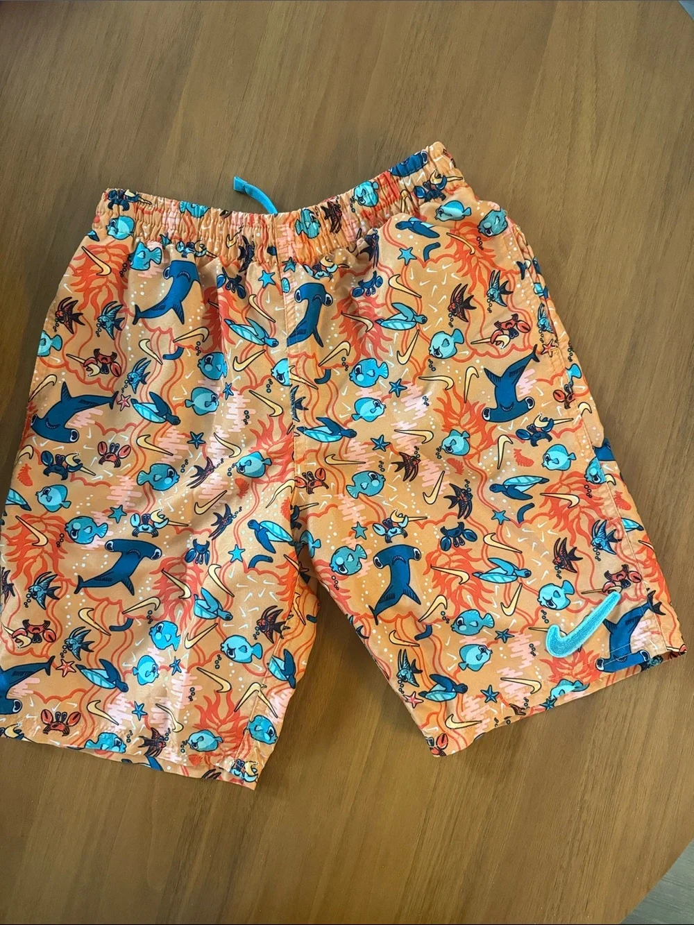 Nike Orange Swim Trunks with Blue Sea Creature Print. 7inch lined